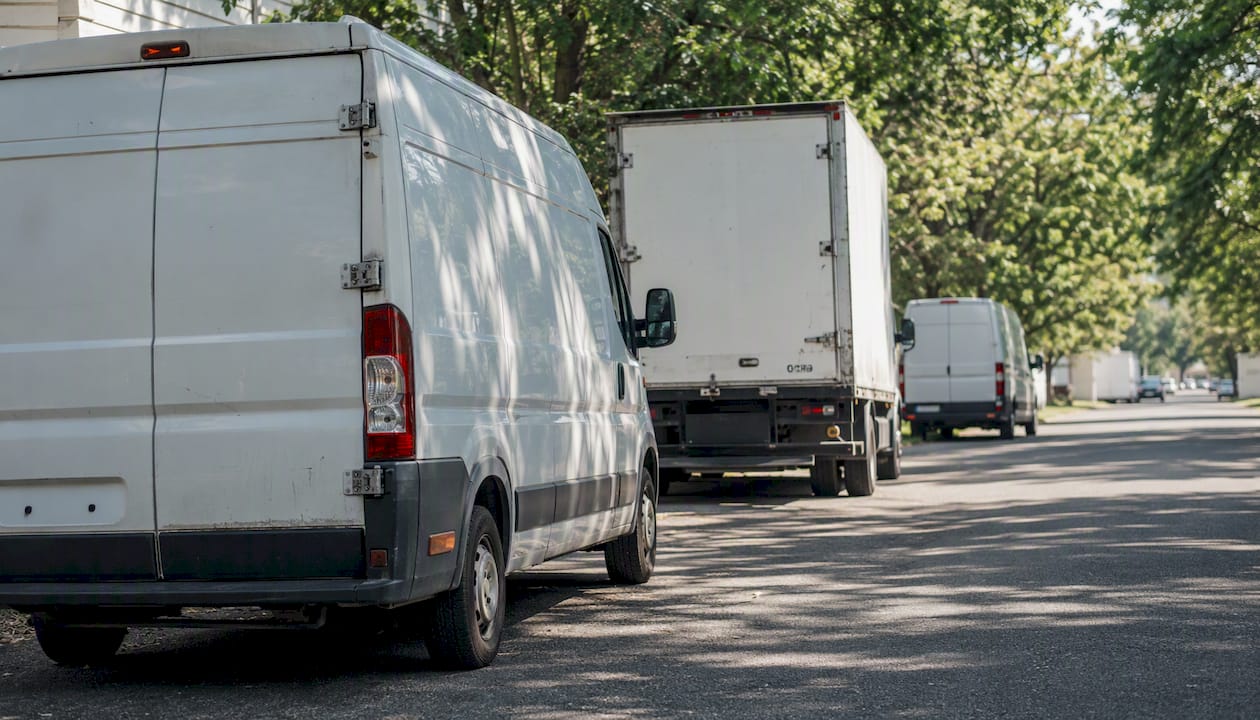 Close-up of cargo van and truck rear wheels and doors