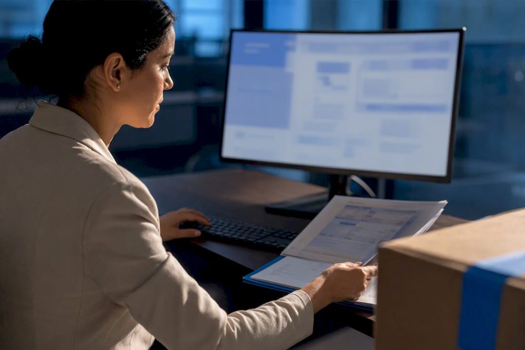 Analyst reviewing shipment screening records