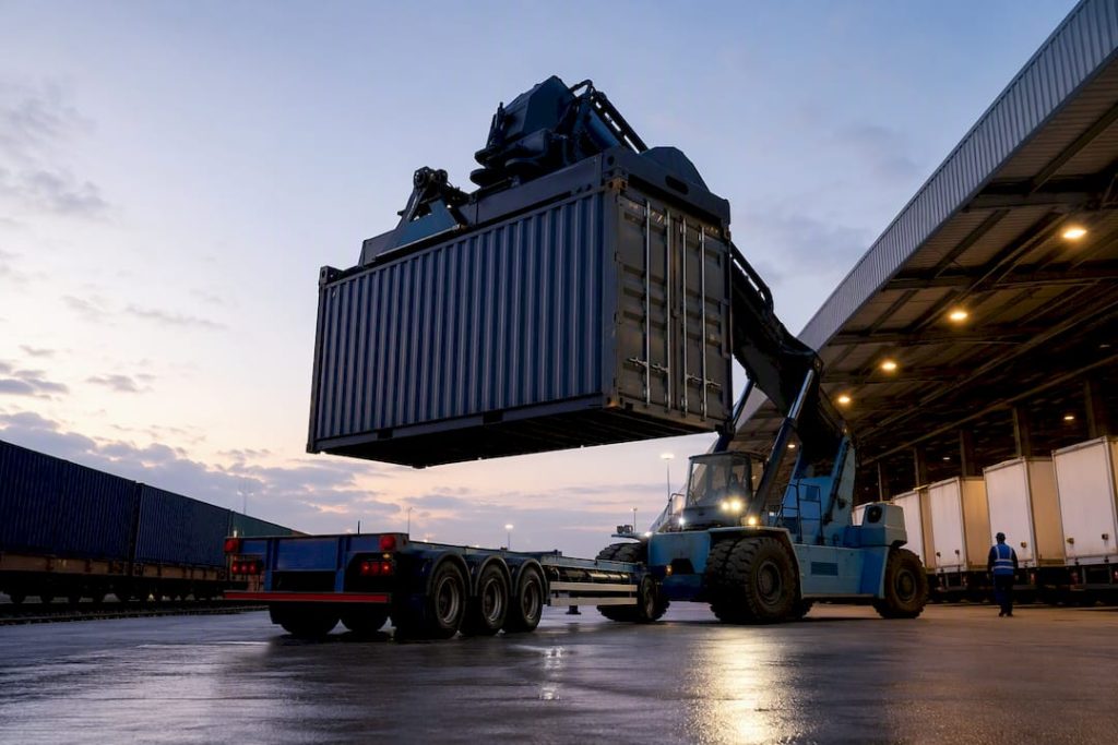 Reach stacker transferring container at transload yard