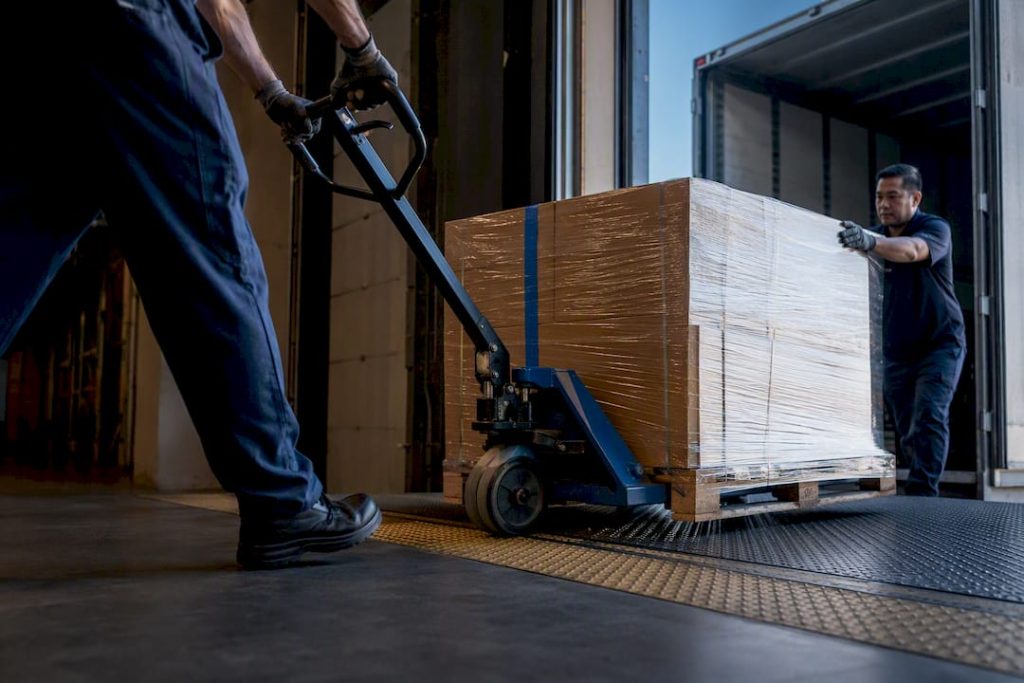 Freight pallet crossing warehouse handoff point
