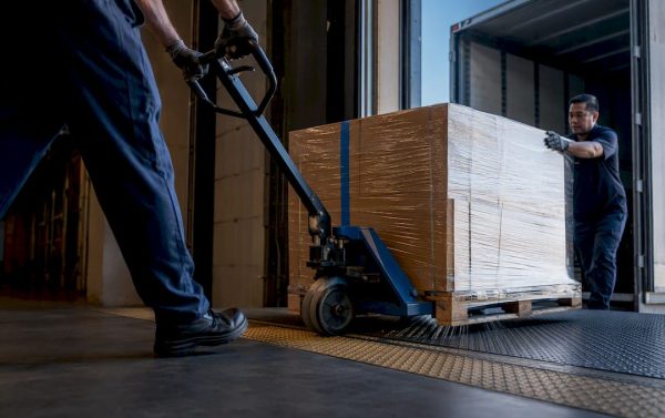 Freight pallet crossing warehouse handoff point
