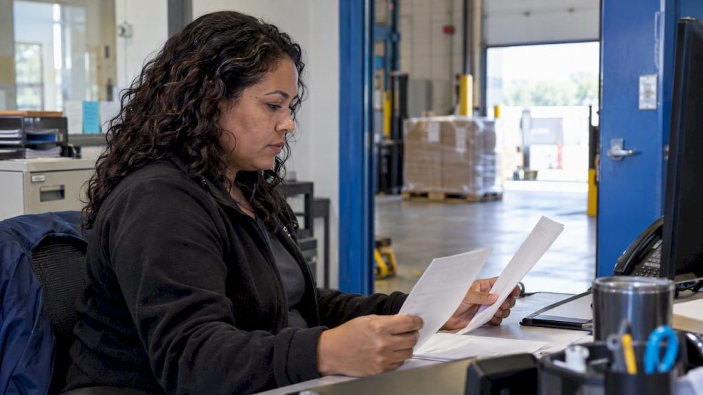 Shipper reviewing an LTL freight bill and quote